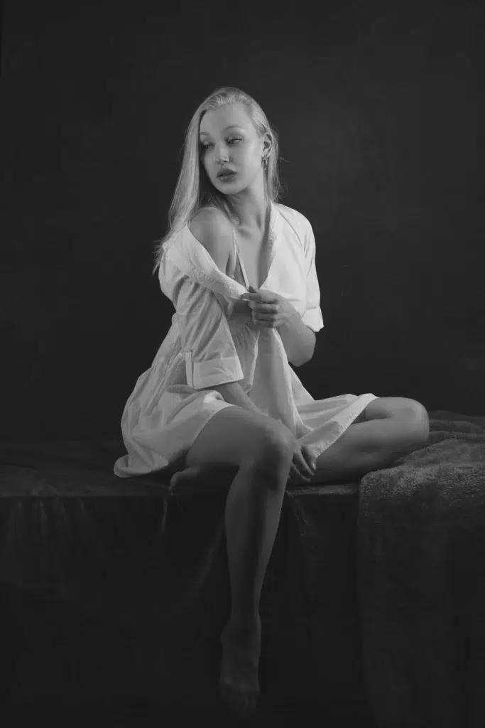 Elegant black and white boudoir portrait of a woman in a white shirt, studio photography by Massen Photography Luxembourg