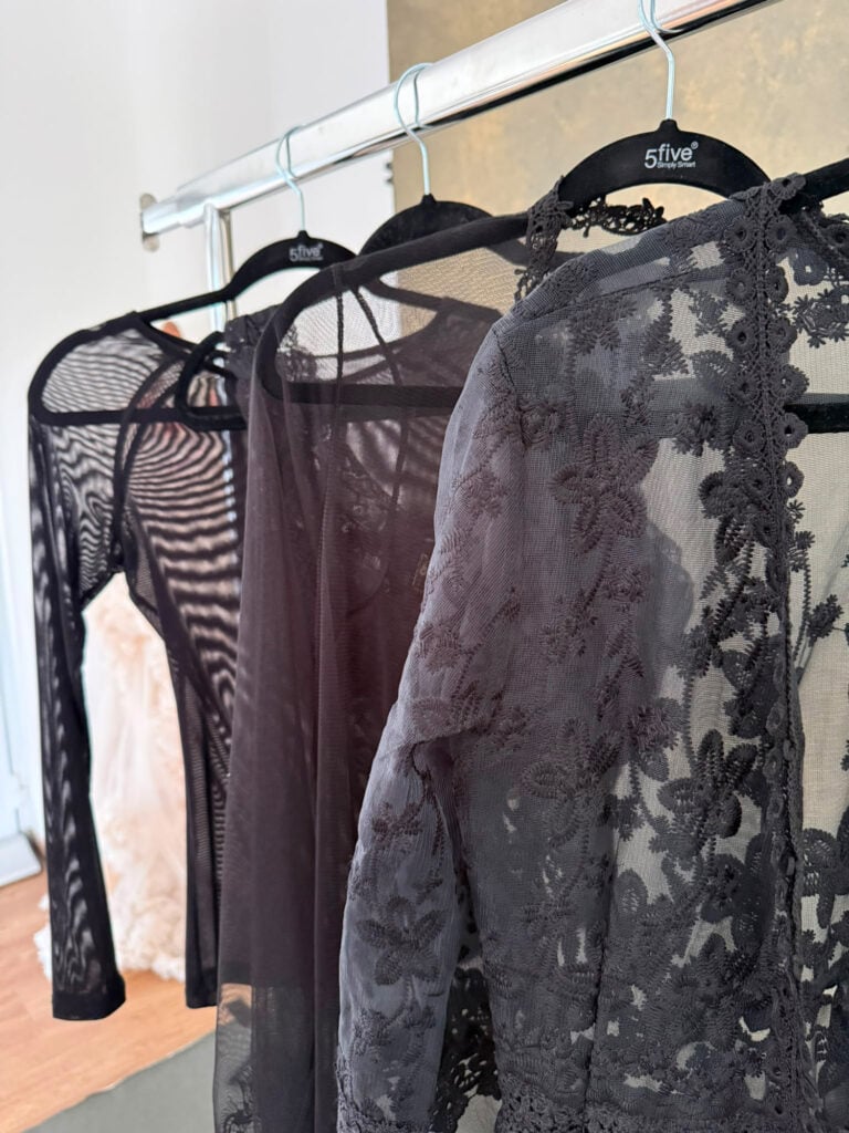 Rack of sheer black lingerie and lace robes in the Massen Photography boudoir wardrobe, Luxembourg