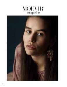 Close-up fine art portrait from a Moevir Magazine editorial, photographed by Alena Massen, featuring statement earrings and soft studio lighting